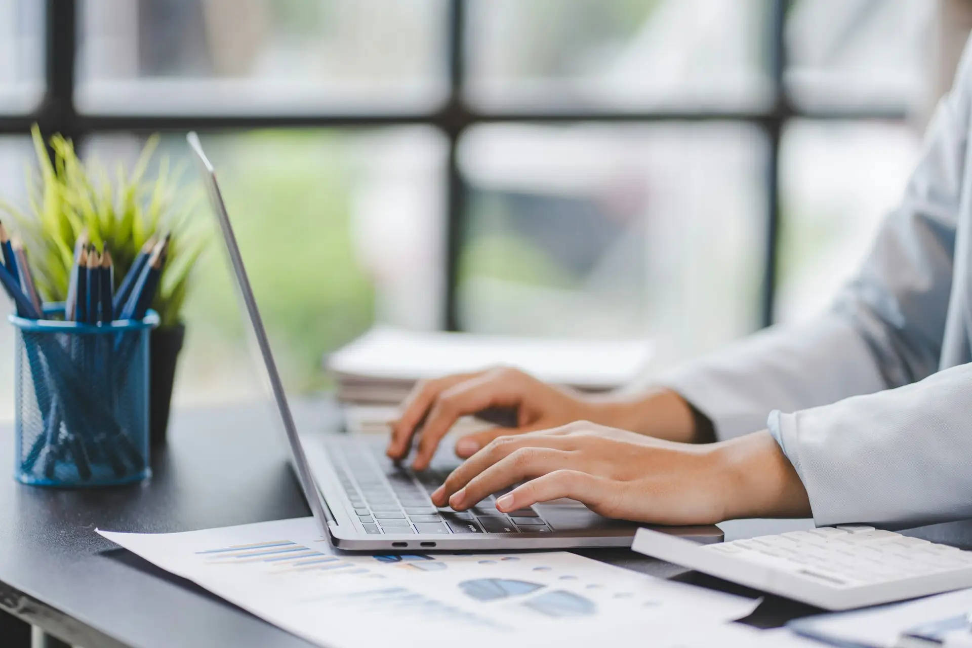 office girl's hands typing input data